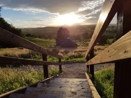 View from outside an octagonal glamping cabin at Little Seed Field in the Yorkshire Dales